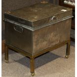 Industrial age silvered metal chest, having a hinged top above the case flanked with handles, and