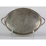 George III sterling silver oval two-handled tray, the shallow tray with raised rim heavily chased