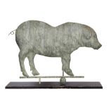 Copper or zinc figural weather vane depicting a pig, rising on a later rectangular wood base, 22"h x