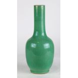 Chinese apple green glazed vase, overall with a crackle glaze, with a stick neck above an ovoid