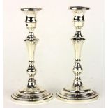 Pair of sterling weighted candlesticks, by Mueck Carey Co., 9"h x 4"dia.