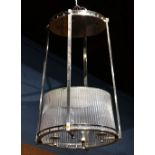 Custom brushed metal and glass light fixture, executed in the Art Deco taste, having square supports