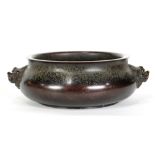 Chinese bronze censer, the compressed body flanked with lion head handles, bottom with apocryphal