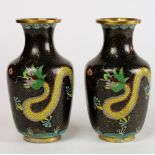 Pair of Chinese cloisonne enameled vases, each with a yellow dragon in pursuit of a jewel, on a