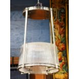 Custom brushed metal and glass light fixture, executed in the Art Deco taste, having square supports