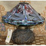 Tiffany style lamp, having a domed shade with dragonfly motif, above the bulbous body, 16"h x 18"