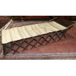 WWI era English campaign cot, executed in stained oak, 22.5"