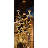 Monumental custom made Italian Murano chandelier, executed in caramel glass with red wrap, the six
