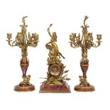 French Louis XVI style gilt bronze mounted rouge marble clock with garniture circa 1900, after