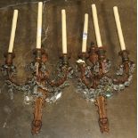 (lot of 2) Louis XV style patinated metal sconces, each having three lights above scrolled arms with