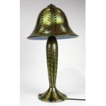 Lundberg Studios iridescent art glass lamp, having a pulled feather design executed in green and