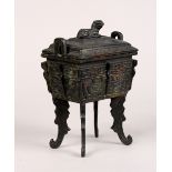 Chinese archaistic bronze rectangular ding form censer, with taotie masks and raised on dragon