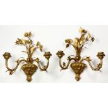 (lot of 2) Neoclassical style giltwood and tole two light sconces, each having floral sprays