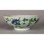 Chinese enameled porcelain bowl, featuring blue chrysanthemums reversed by a poem, the base with