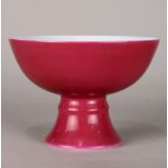 Chinese porcelain footed bowl, the exterior of rose pink hue, the interior decorated with peaches,