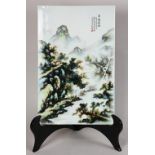 Chinese porcelain plaque, enameled with a landscape scene with figures fishing along the river,