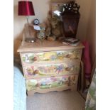 A painted and decorated chest of 3 long drawers