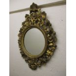 A small carved gilt wood wall mirror