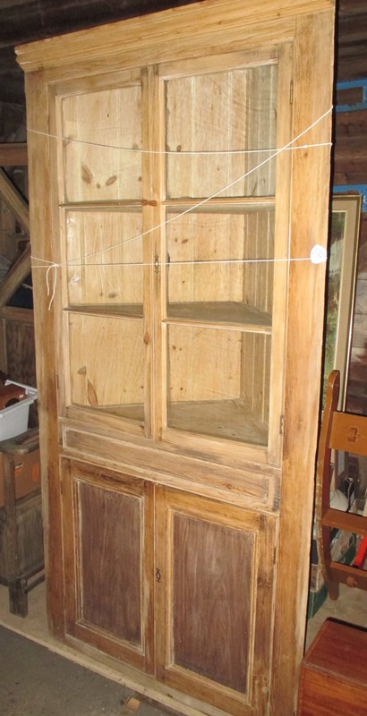 A good 19th century waxed pine "Essex" corner cupboard with glazed upper section