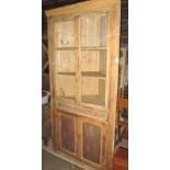 A good 19th century waxed pine "Essex" corner cupboard with glazed upper section