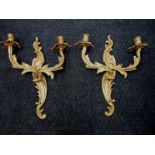 A pair of twin branch wall sconces