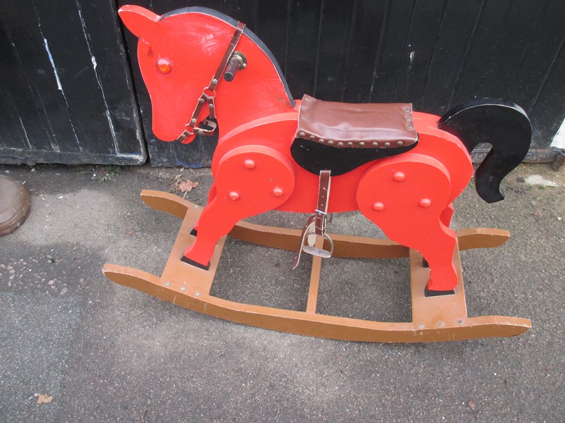 A vintage panel rocking horse on bow rockers