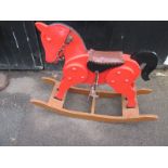 A vintage panel rocking horse on bow rockers