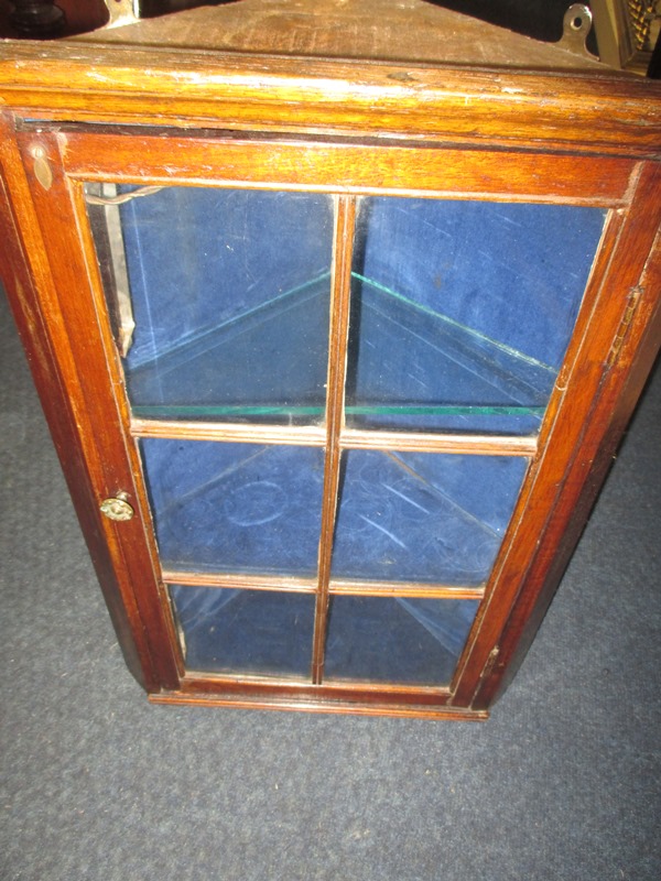 A small Victorian wall mounted corner display cabinet