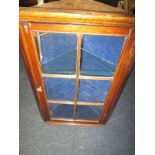 A small Victorian wall mounted corner display cabinet