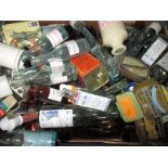 A large quantity of vintage collectable bottles and tins