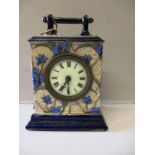 A ceramic mantle clock and key