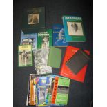 A quantity of cricketing books relating to Don Bradman most having authenticated autographs of