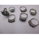 7 Silver dress rings set with various semi-precious stones