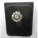 An art deco gold and diamond ring, the central stone being approximately 1ct surrounded by 10