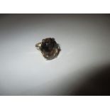 A 9ct gold ring set with large Smokey Quartz stone