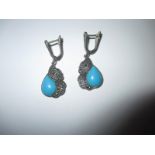 A pair of silver, marcasite and turquoise earring