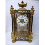 A 19th century gilt brass champlevé enamel 4 glass mantle clock with a billet compensation pendulum