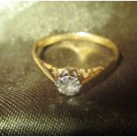 A vintage gold and solitaire diamond ring