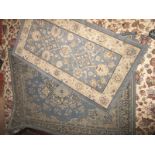 Two vintage blue ground rugs