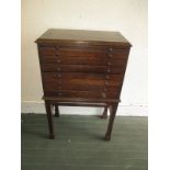 A circa 1920s small 7 drawer collectors chest on stand