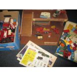 A quantity of vintage die cast model vehicles and a wood garage