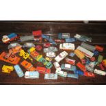 A large quantity of vintage play worn die-cast vehicles