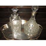 A silver mounted decanter and one other on tray