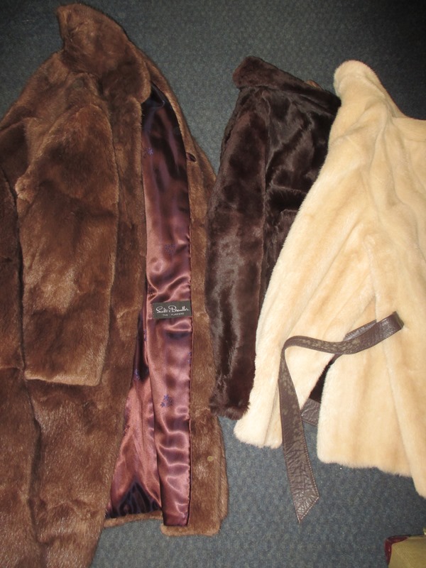 A 3/4 length Musquash fur coat and two faux fur jackets