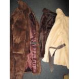 A 3/4 length Musquash fur coat and two faux fur jackets