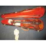 An early 19th century German violin and bow in fitted hard case, label reads Georg Kloz in Mitten