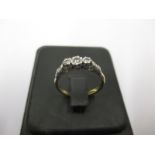 An 18ct gold, platinum and 3 stone diamond ring
