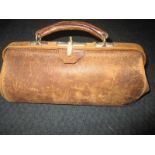 A late 19th century leather Gladstone bag with key