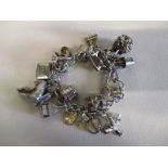 A sterling silver charm bracelet, approx weight 87g