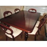 A mahogany extending dining table and 6 chairs